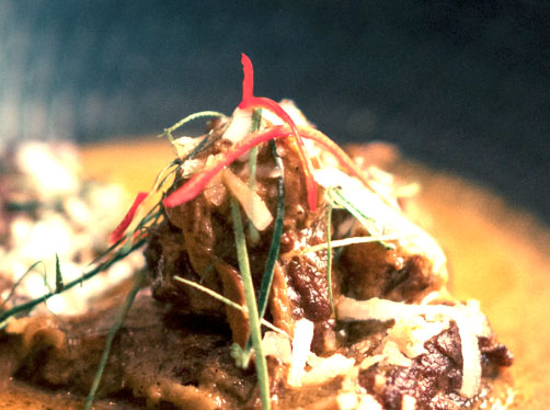 Traditional Indonesian beef rendang cooked in rich coconut curry, a Beach Almond Southeast Asian classic.