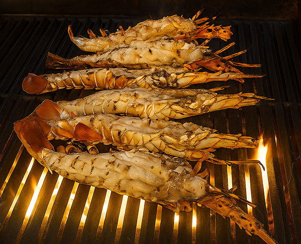 Chargrilled tropical cray lobster from Thursday Island served with turmeric coconut chilli sauce, enhancing the smoky flavour at Beach Almond Palm Cove.