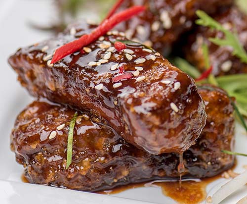 Beach Almond’s signature caramel sticky pork ribs, slow-cooked and glazed with rich Southeast Asian spices.